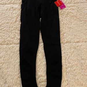 Spanx seamless crop leggings in black and blue. NWT size M